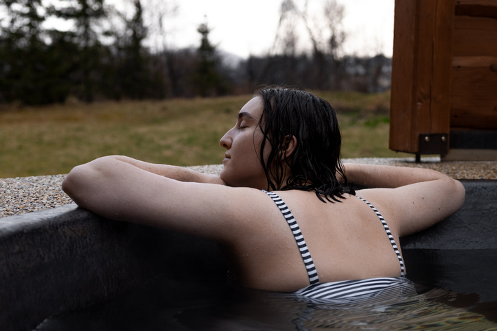 a woman doing a cold plunge therapy